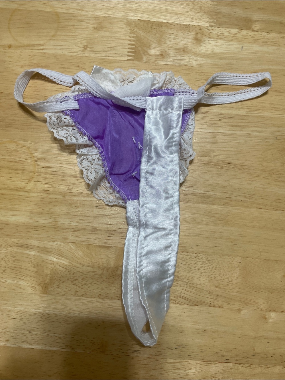 Frederick's of Hollywood Lavender Satin Thong with White Lace & Bow - Picture 2 of 3